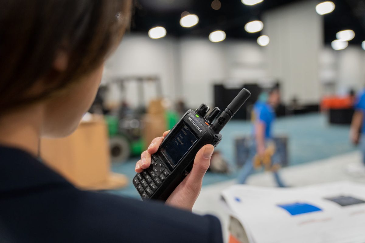 Woman talking on a Two-Way Radio