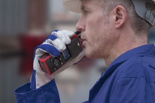 Construction worker using 2 way radio